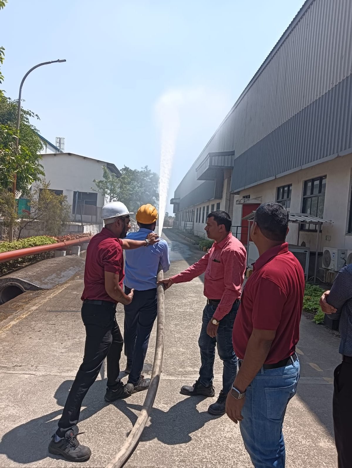 Fire protection team conducting a hydrant flow test at an industrial facility